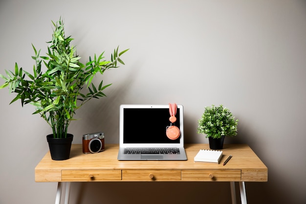 Desk with laptop and headphones