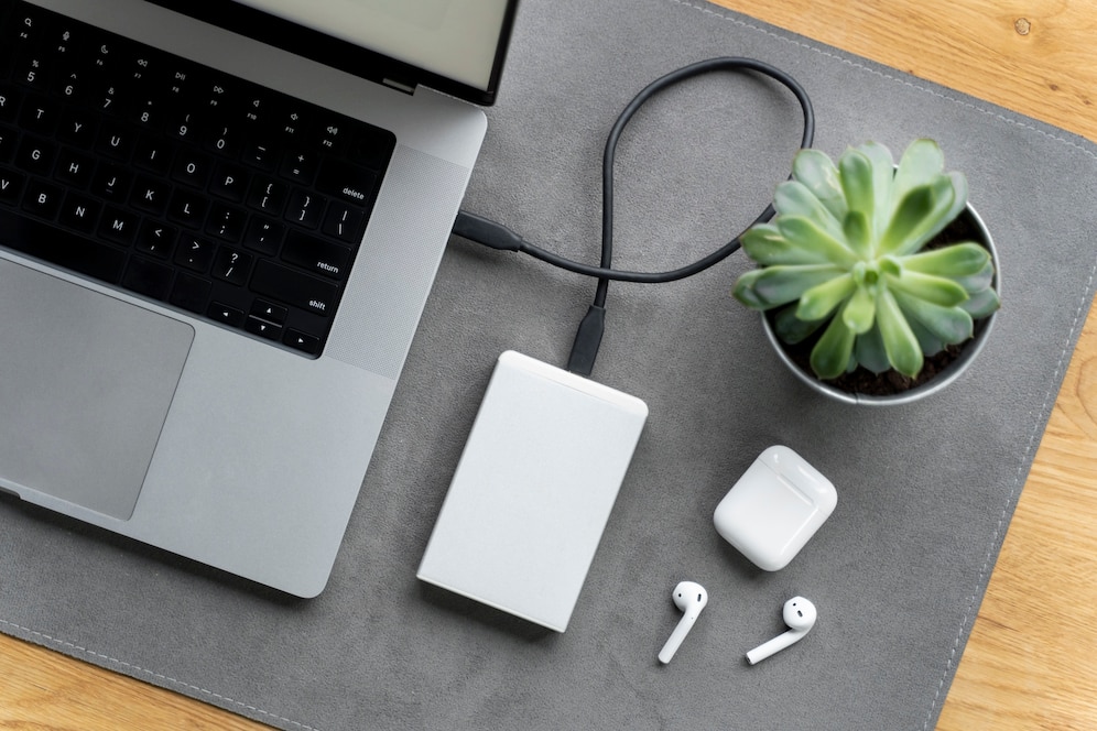 Laptop power bank on table