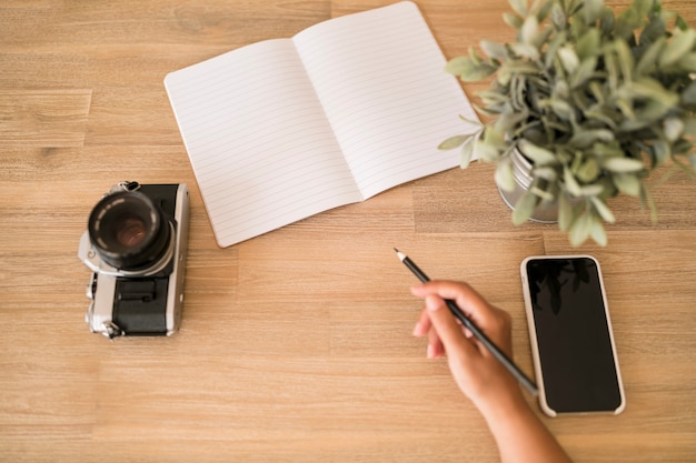 Desktop with notebook and mobile phone