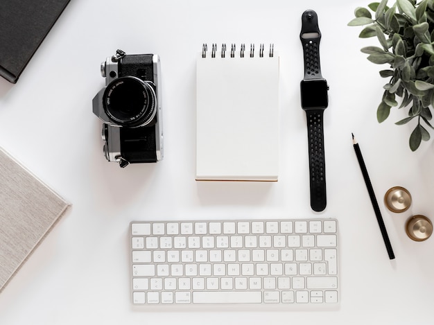 Desktop with notebook and watch