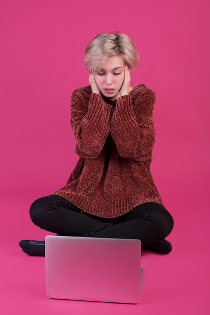 Desperate woman with laptop