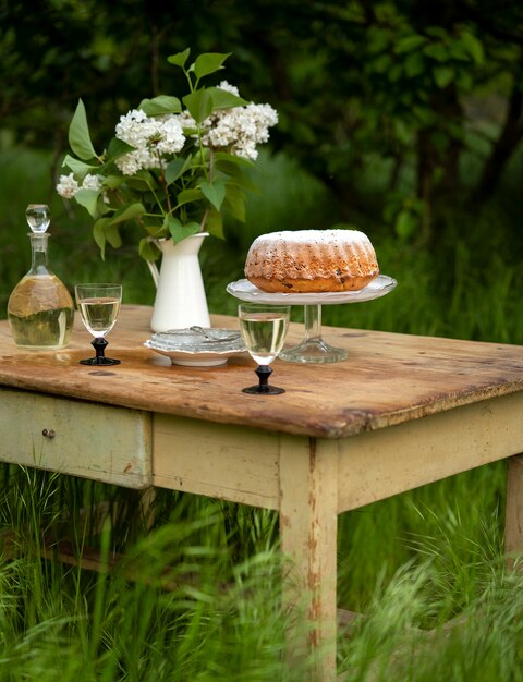 Dessert and flowers on table