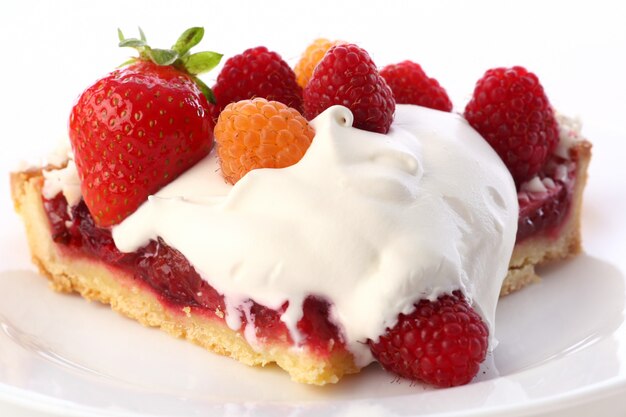 Dessert fruitcake cake with whipped cream
