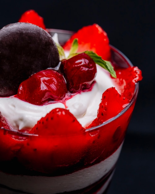 Dessert ice cream with strawberries and cherries