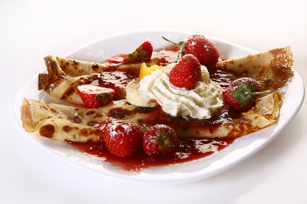 Dessert plate witn pancakes and strawberry