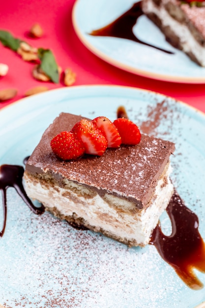 Dessert topped with cacao and strawberries