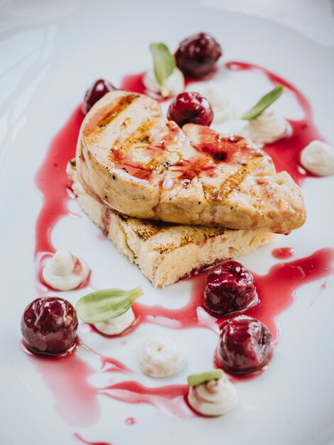 Dessert with cherries and fruit syrup