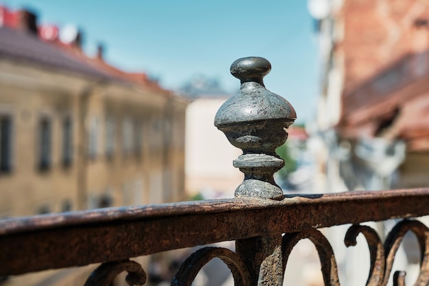 Free photo detail of the openwork lattice of the old balcony on the background of the old city closeup selective focus idea for a banner or background