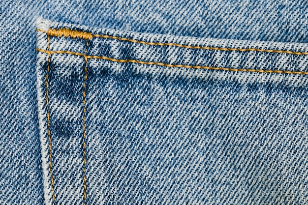 Details on blue jeans pocket close-up