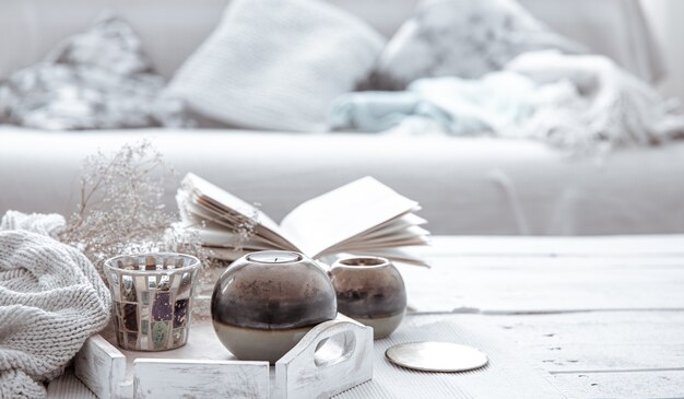 Details of the decor on the table in the living room in a hygge style