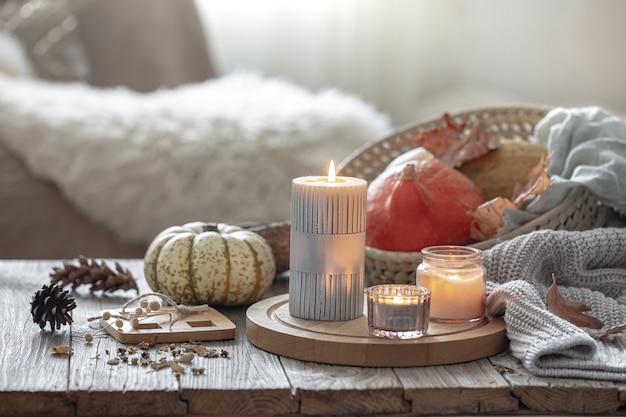 Details of home autumn decor in rustic style in the interior of the room, close-up.