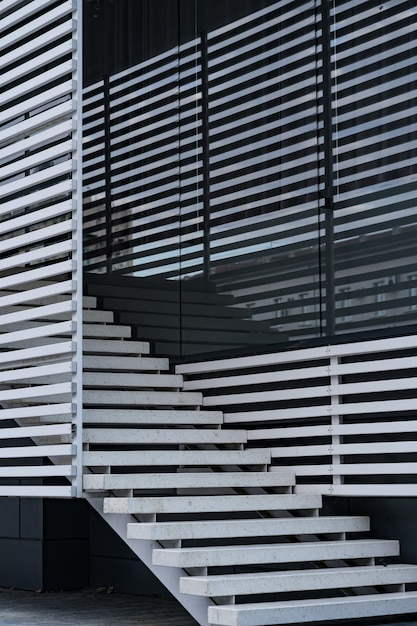 Free photo details of railing and stairs of a modern building and shadow reflection on windows