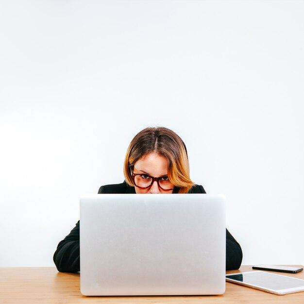 Determined office worker looking at camera