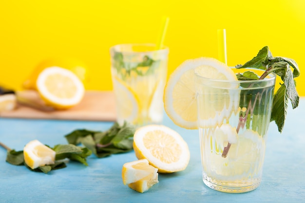 Detox lemon water in two glasses. Delicous homemade lemonade