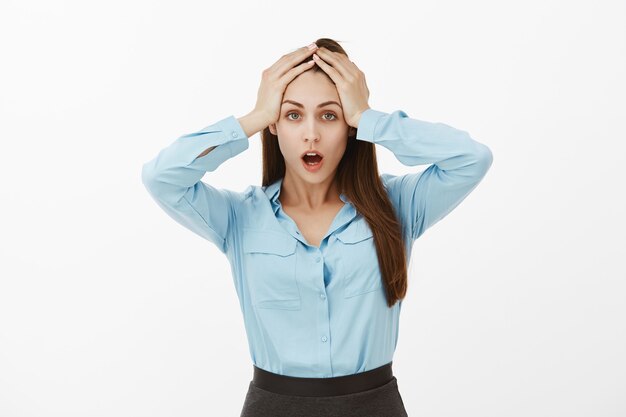 devastated brunette businesswoman posing in the studio