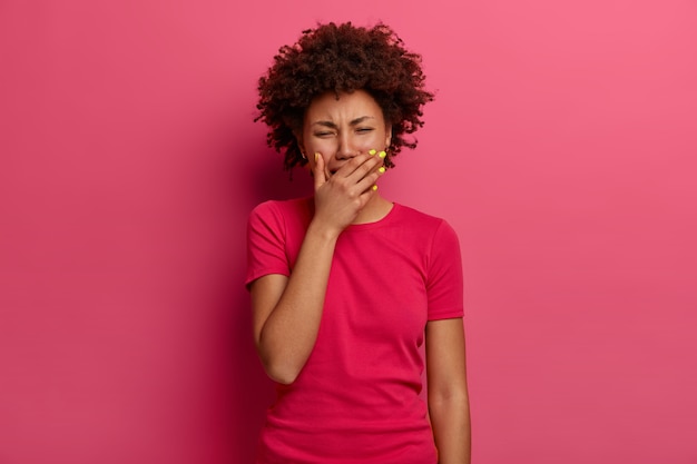 Devastated curly Afro American woman feels hurt, cries from despair