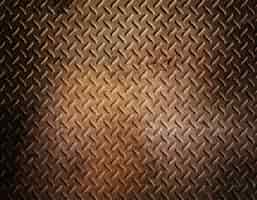 Free photo diamond plate metal background with grunge rusty effect