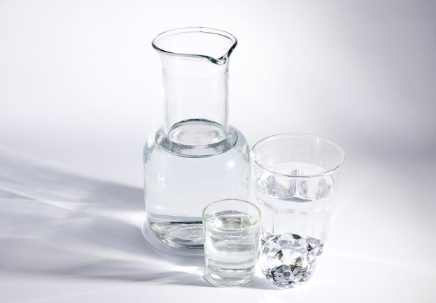 Diamond with glass containers on white background