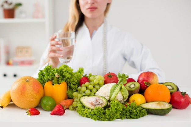 Diet concept with female scientist and healthy food