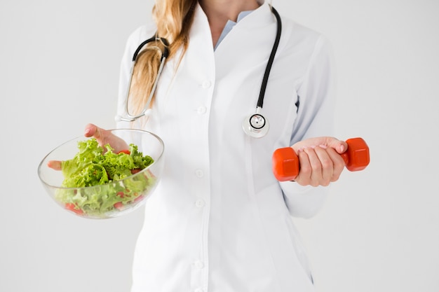 Diet concept with female scientist and healthy food