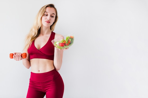 Free photo diet concept with sport woman and healthy food