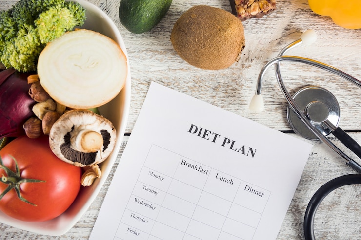 Free Photo diet plan with vegetables and stethoscope on wooden desk