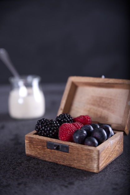Free photo diet with blueberries, raspberries, blackberries and yogurt.