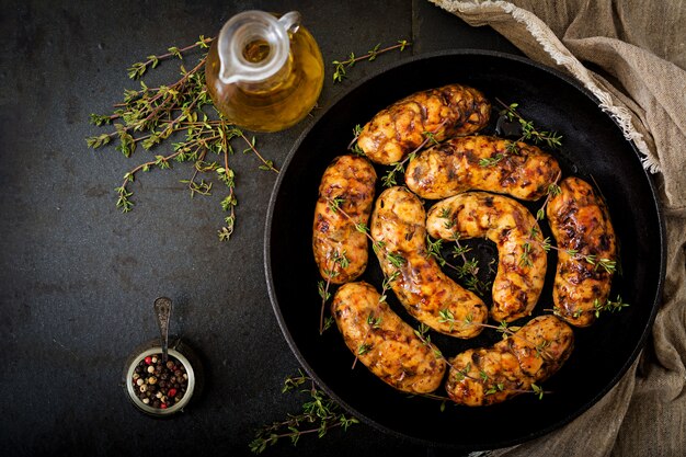 Dietary sausages from turkey fillet and mushrooms in pan