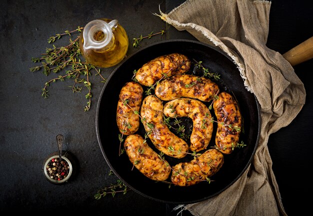 Dietary sausages from turkey fillet and mushrooms in pan