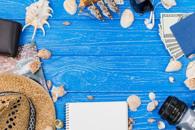 Free photo different accessories among seashells and money