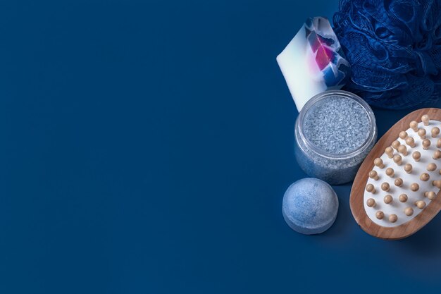 Different body care items on blue surface