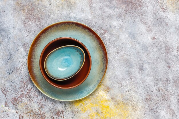 Different ceramic empty plates and bowls.