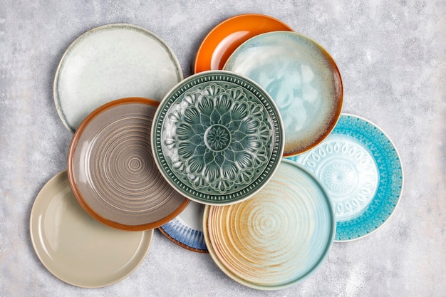 Free photo different ceramic empty plates and bowls.