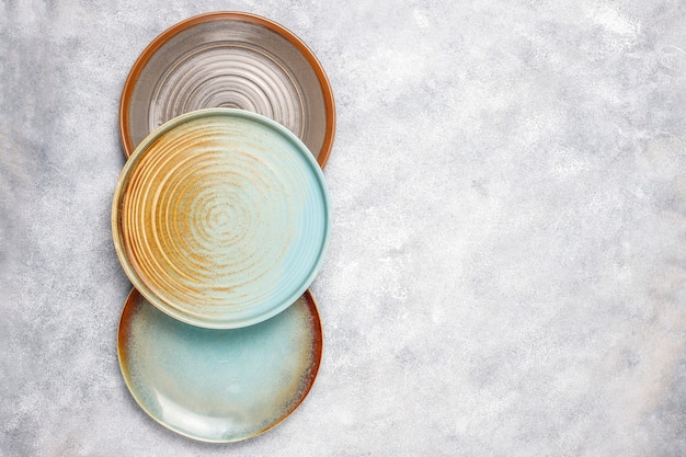 Free photo different ceramic empty plates and bowls.