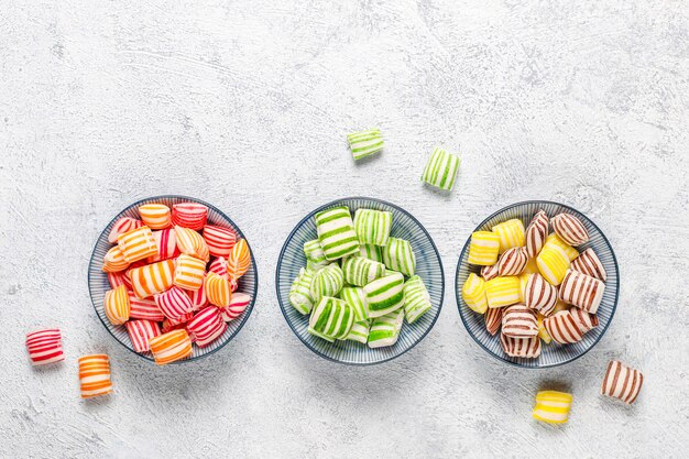 Different colorful sugar candies, top view