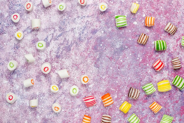 Different colorful sugar candies, top view