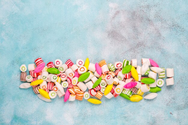 Different colorful sugar candies, top view