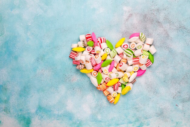 Different colorful sugar candies, top view