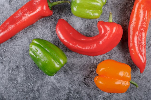 Different colors and kinds of hot chili peppers. Top view.