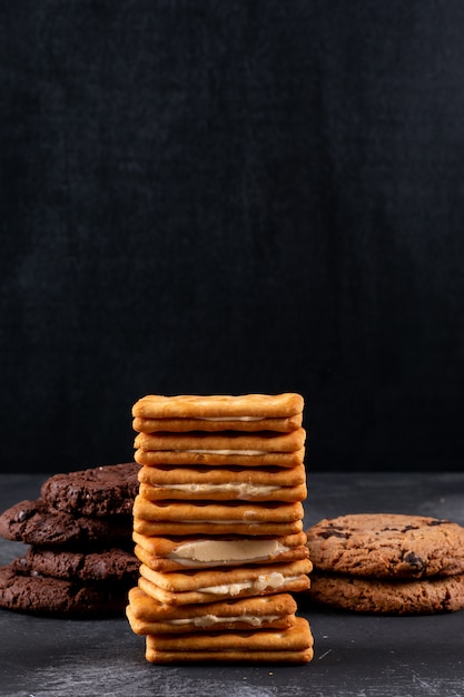 Different cookies on dark surface