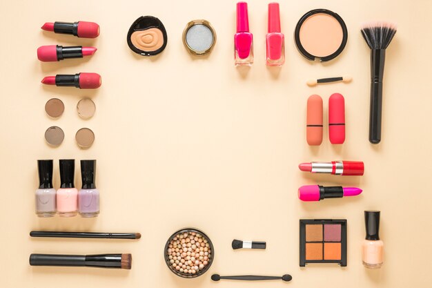 Different cosmetics types on beige table 