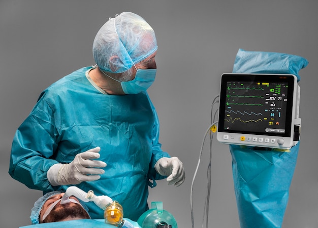 Different doctors doing a surgical procedure on a patient