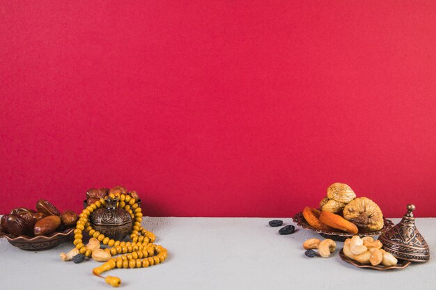 Different dried fruits with nuts and beads