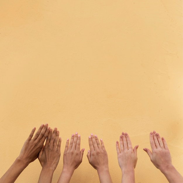 Different ethnicities girls hands with copy space
