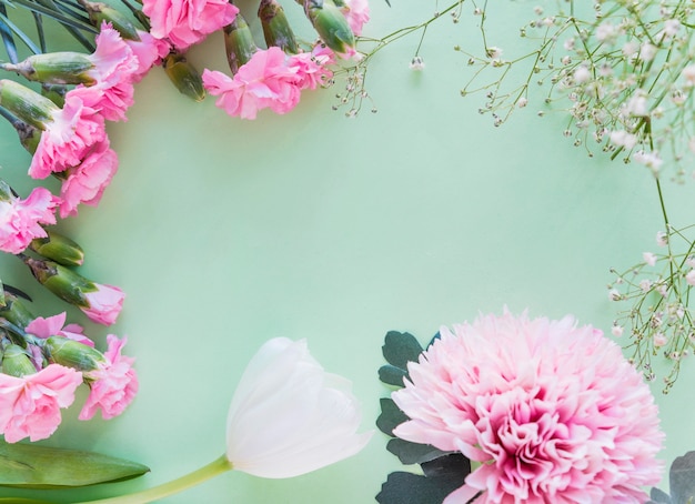 Different flowers branches on table 