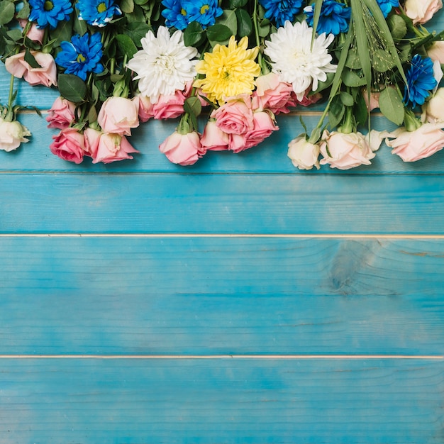 Different flowers on table