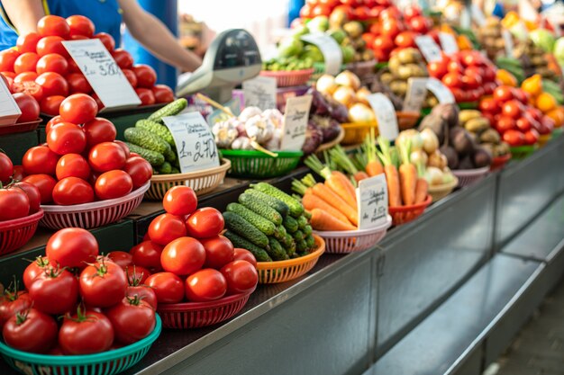 Different fresh vegetables in baskets on counter.