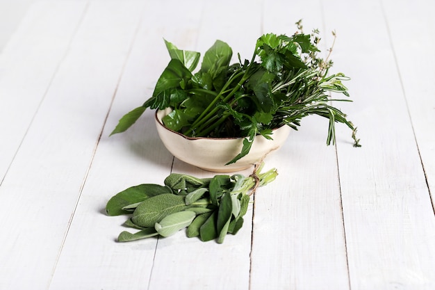 Free photo different herbs in a bowl