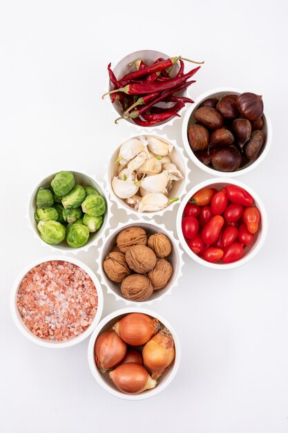 Different ingredients in white bowls