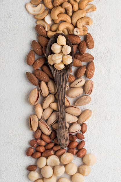 Different kinds of nuts and spoon